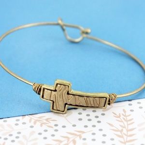Worn Gold tone Animal Print Cross Bangle
